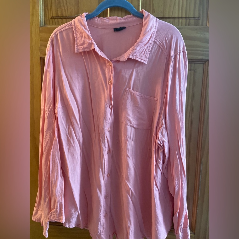 Light pink button down long sleeve shirt.